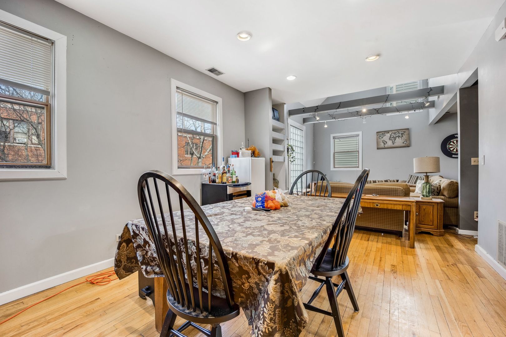 Undisclosed Address Chicago, IL 60657 - Photo 6 of 13 a dining room with furniture and wooden floor