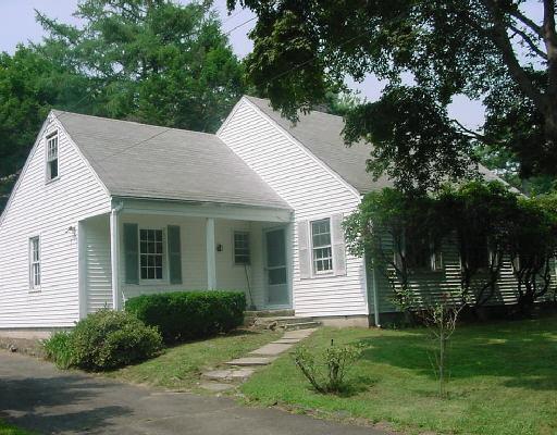 396 High Ridge Road Stamford, CT 06905 - Photo 1 of 1 a view of a white house with a yard and potted plants