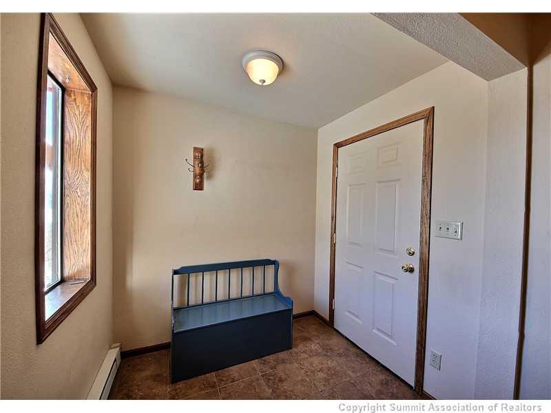 48 AB Road Silverthorne, CO 80498 - Photo 17 of 25 a view interior of a house with wooden floor and windows
