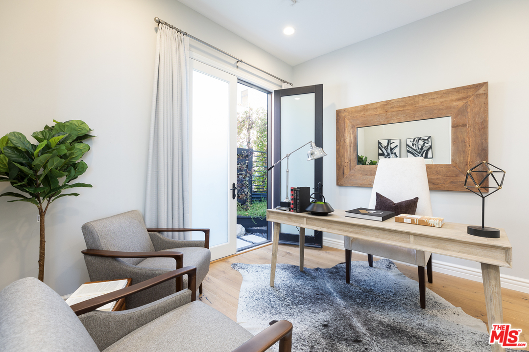 21370 Rambla Vista Malibu, CA 90265 - Photo 11 of 22 a living room with furniture and a potted plant
