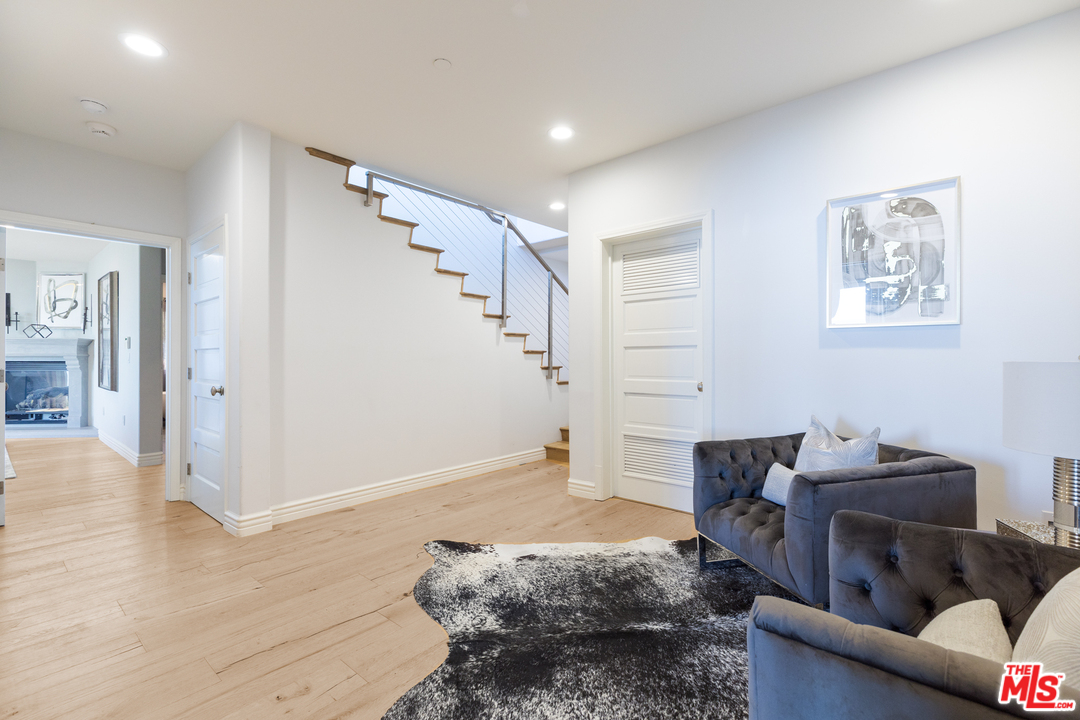 21370 Rambla Vista Malibu, CA 90265 - Photo 13 of 22 a living room with furniture and a wooden floor