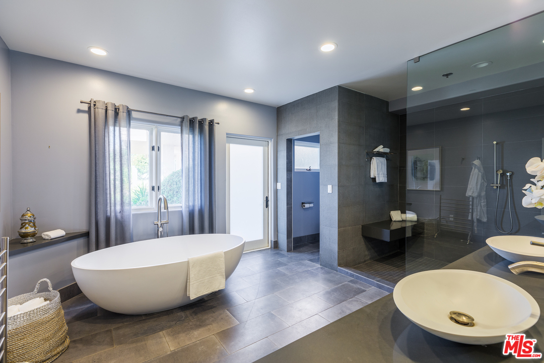 21370 Rambla Vista Malibu, CA 90265 - Photo 17 of 22 a bathroom with a tub and mirror