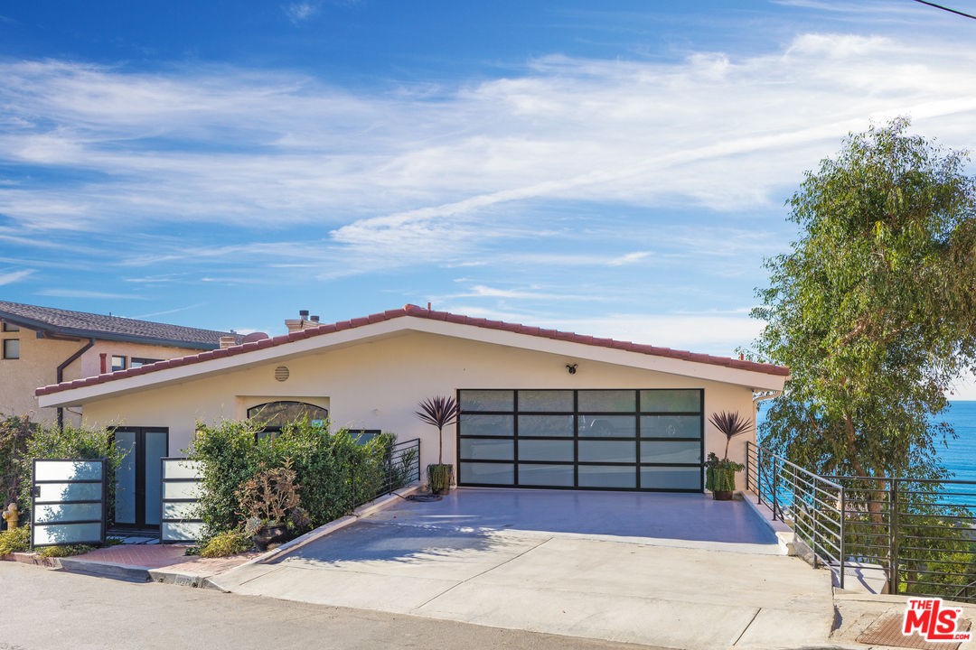 21370 Rambla Vista Malibu, CA 90265 - Photo 2 of 22 front view of a house with a garage
