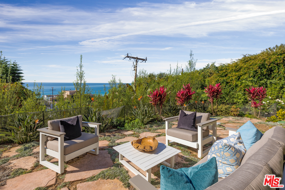 21370 Rambla Vista Malibu, CA 90265 - Photo 22 of 22 a view of a chairs and table in a patio
