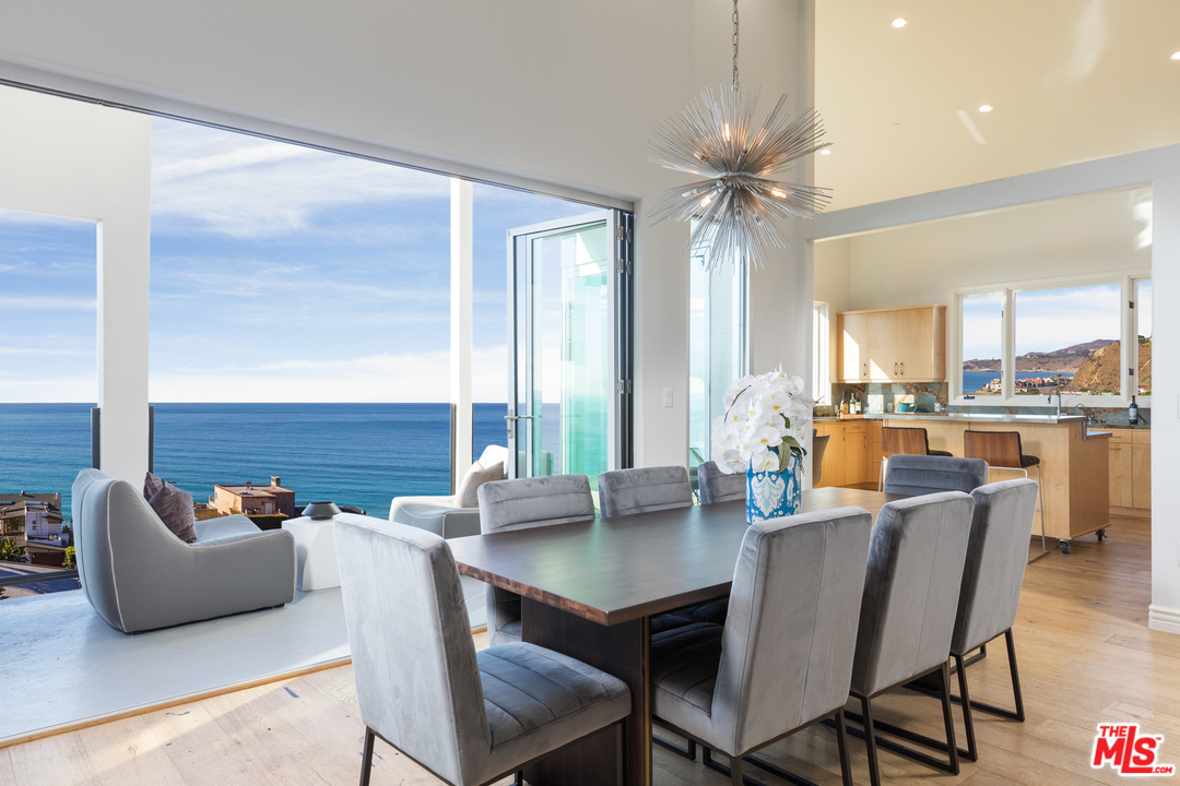 21370 Rambla Vista Malibu, CA 90265 - Photo 8 of 22 a view of a dining room with furniture window and outside view