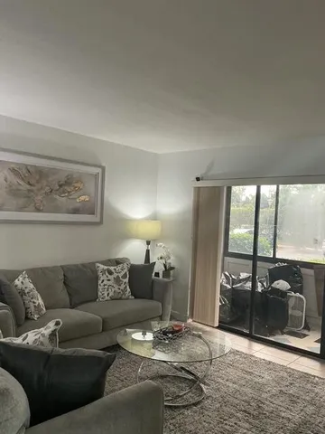 a white toilet sitting next to a shower curtain