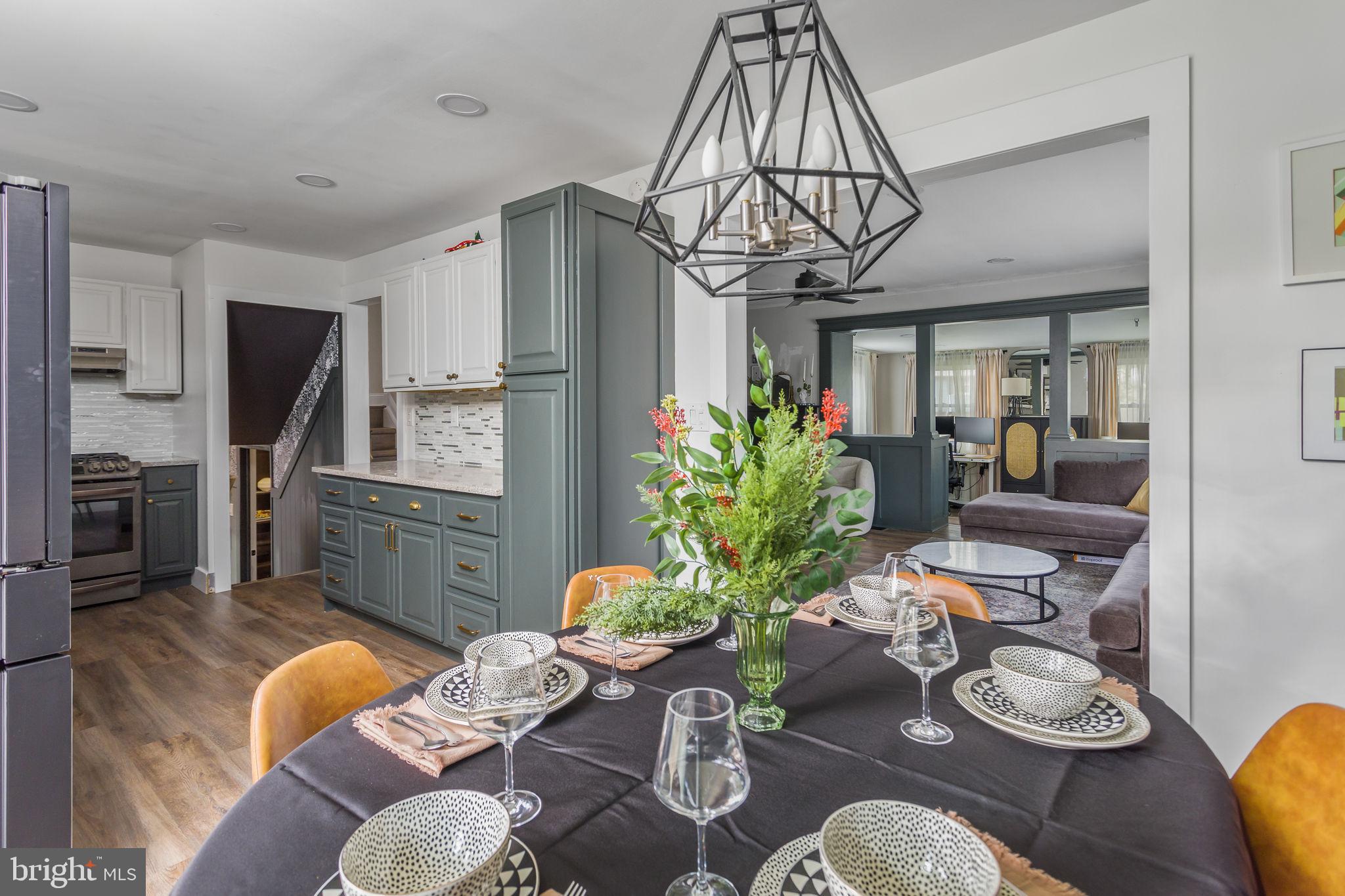 2 Spruce Road Burlington, NJ 08016 - Photo 14 of 34 a living room with furniture a chandelier and kitchen view