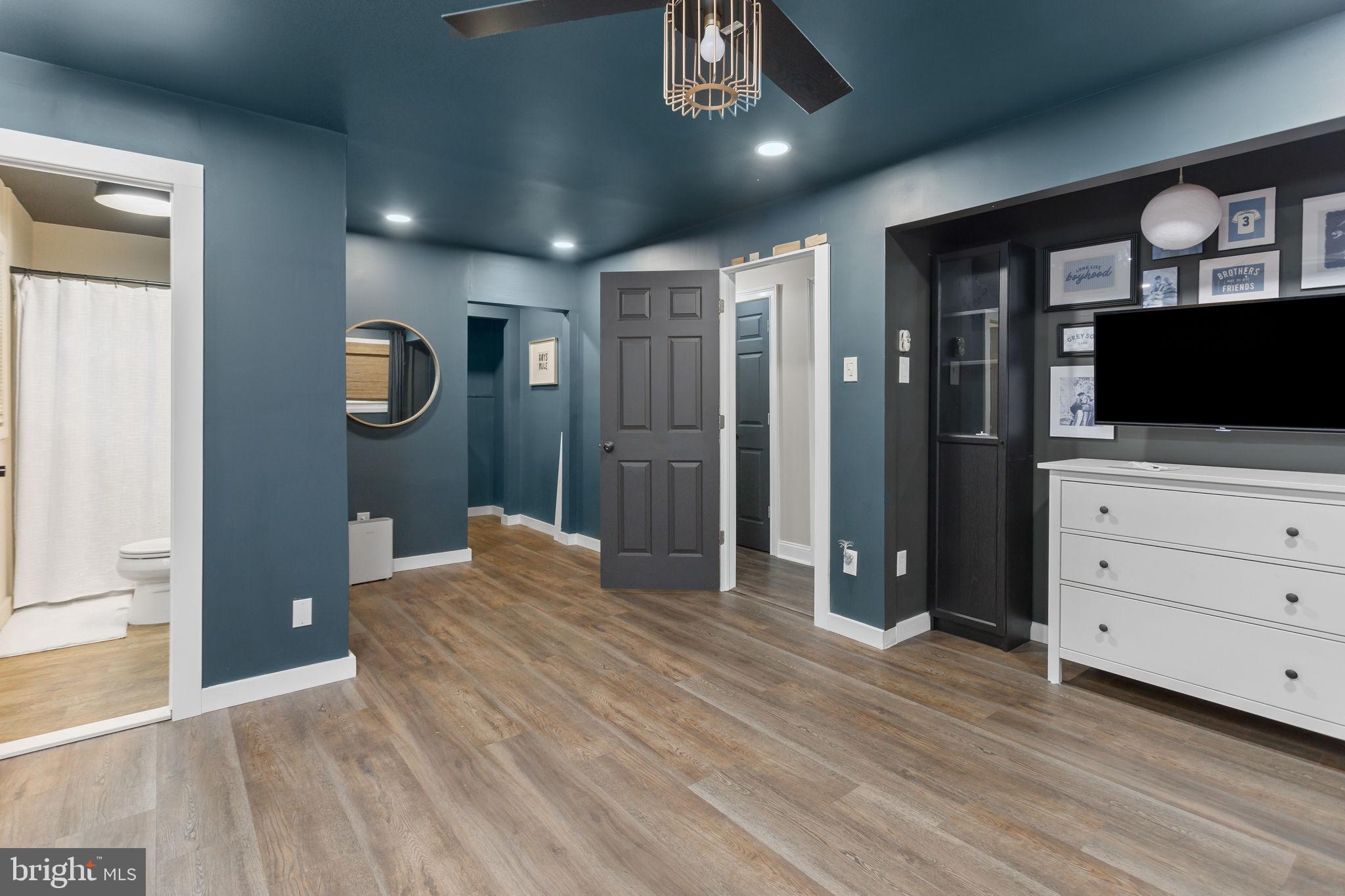 2 Spruce Road Burlington, NJ 08016 - Photo 15 of 34 a bedroom with a bed and a flat screen tv