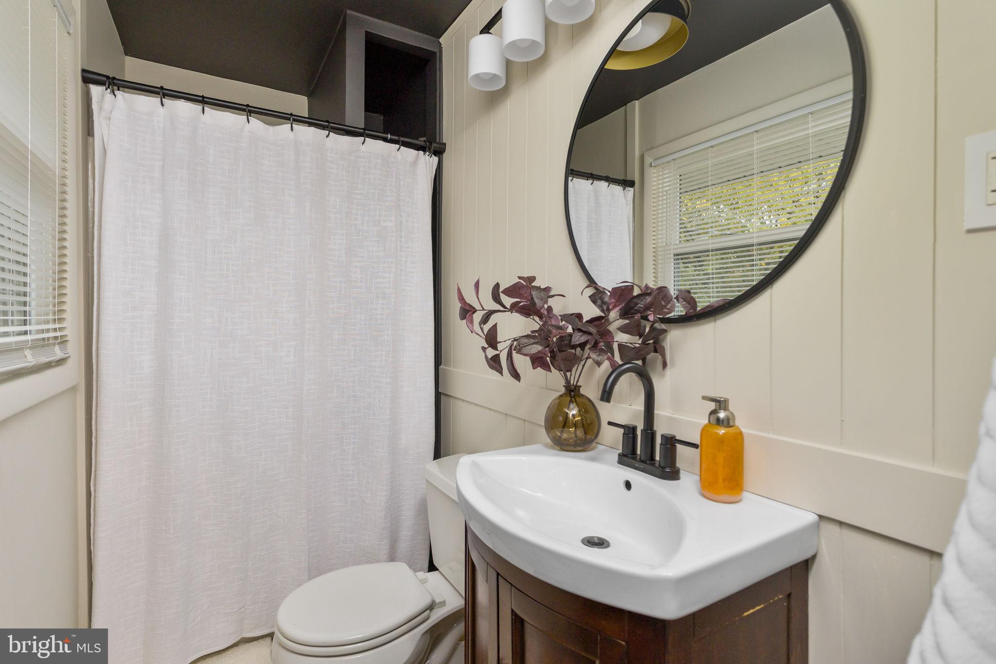 2 Spruce Road Burlington, NJ 08016 - Photo 17 of 34 a bathroom with a sink vanity mirror and toilet