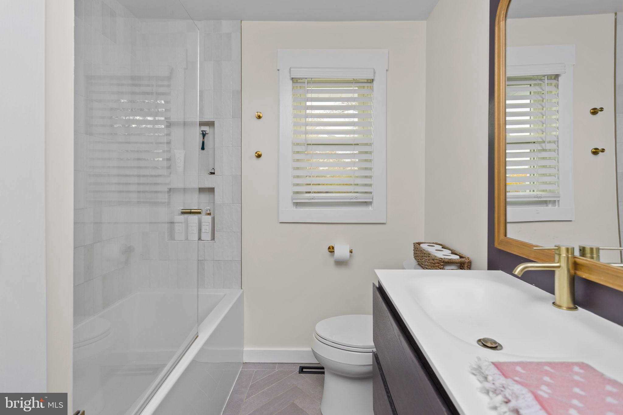 2 Spruce Road Burlington, NJ 08016 - Photo 20 of 34 a bathroom with a sink a toilet and bathtub