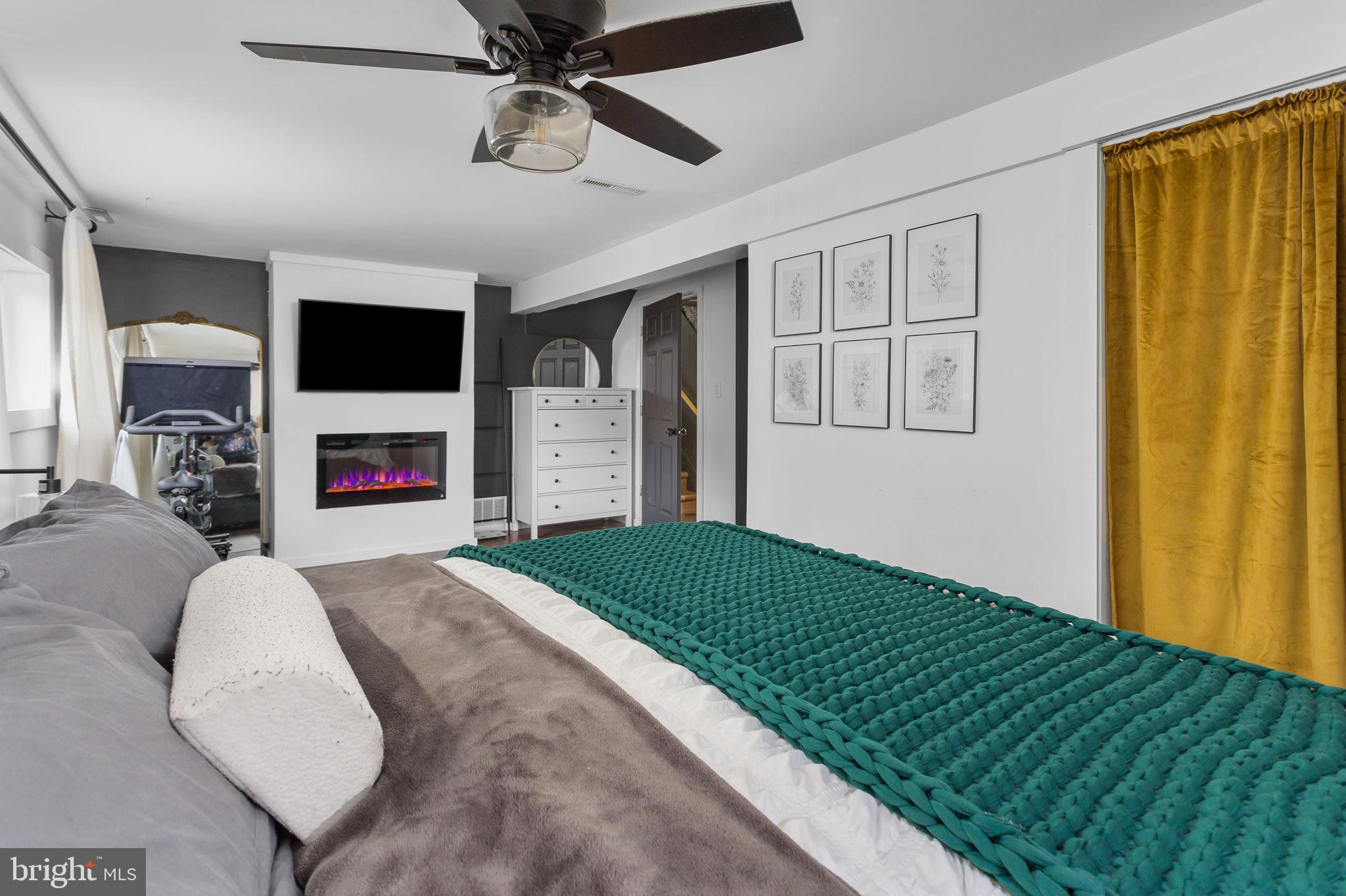 2 Spruce Road Burlington, NJ 08016 - Photo 23 of 34 a living room with fireplace furniture and a flat screen tv
