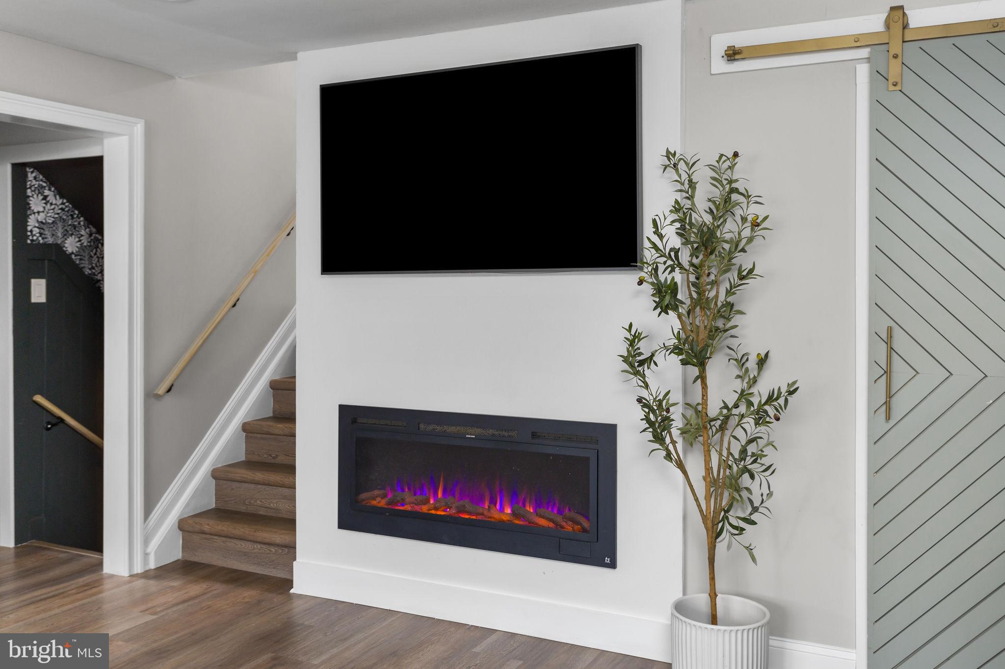 2 Spruce Road Burlington, NJ 08016 - Photo 24 of 34 a living room with a fireplace and wooden floor