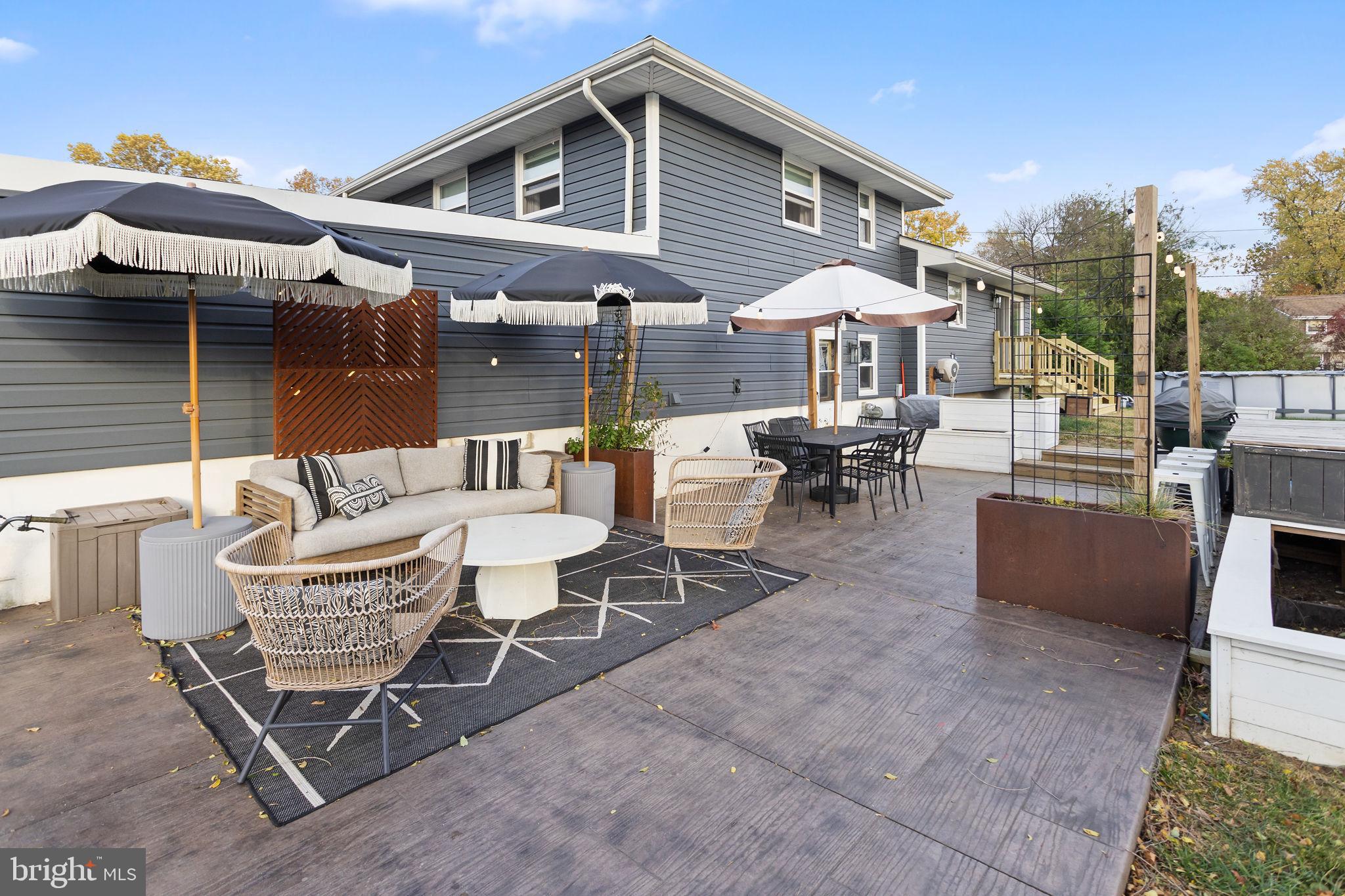 2 Spruce Road Burlington, NJ 08016 - Photo 27 of 34 a outdoor space with patio the couches and a dining table with the garden view