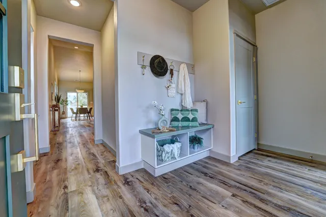 a view of living room with furniture and wooden floor