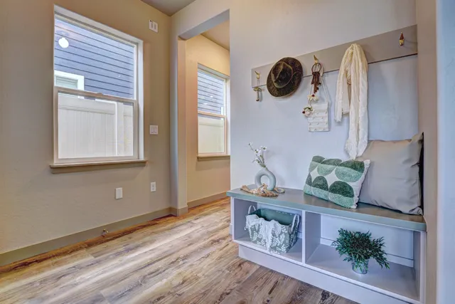 a view of an entryway with wooden floor