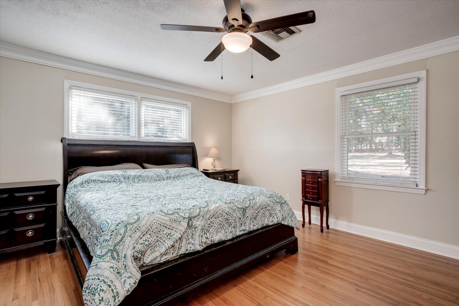 2945 Wagener Road Aiken, SC 29801 - Photo 14 of 47 a bedroom with a bed dresser and a window