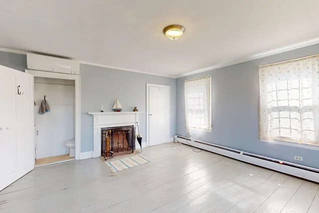 a bed room with a bed and a fireplace