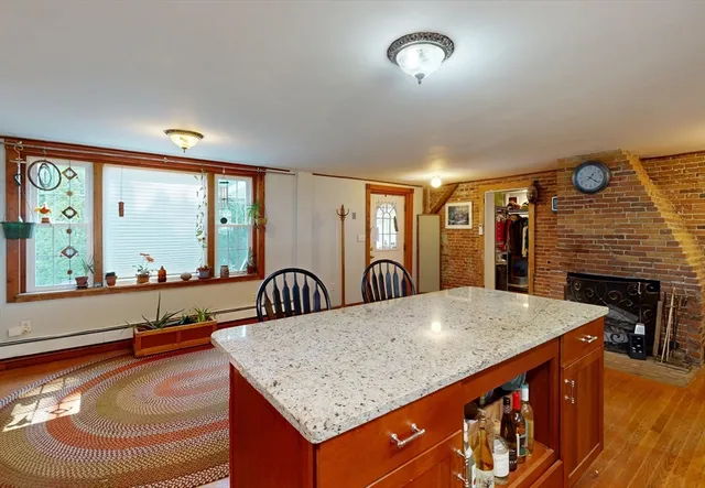 a kitchen with stainless steel appliances granite countertop a sink and a refrigerator