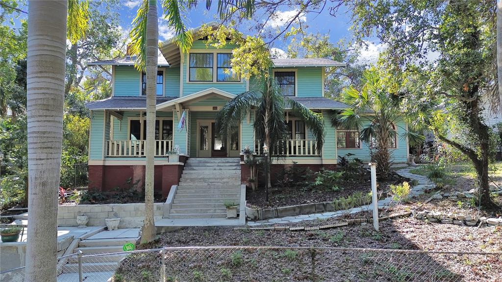 682 Roser Park Drive South St. Petersburg, FL 33701 - Photo 1 of 1 a front view of a house with garden