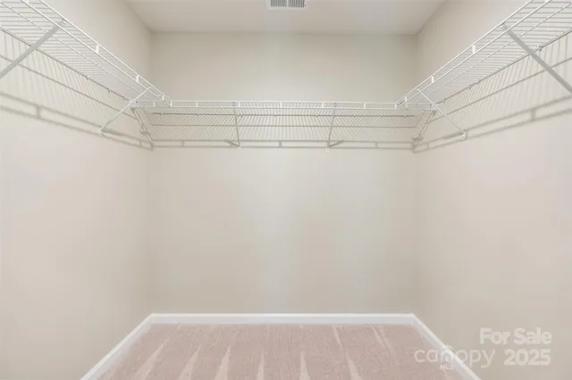 a view of a room with racks on the wall