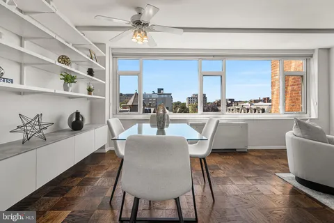 a kitchen with stainless steel appliances granite countertop a stove a refrigerator and a microwave