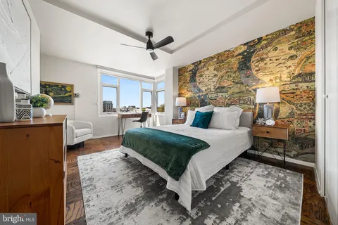 a bed room with a bed and a dresser