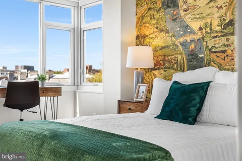 a view of a balcony with chairs