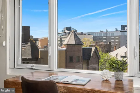 a view of a balcony with furniture