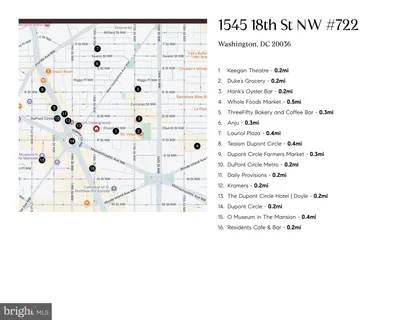 a front view of a building with cars