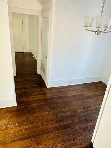 a view of closet area with wooden floor