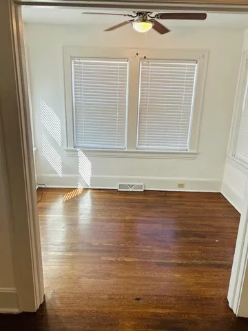 a view of a livingroom with wooden floor