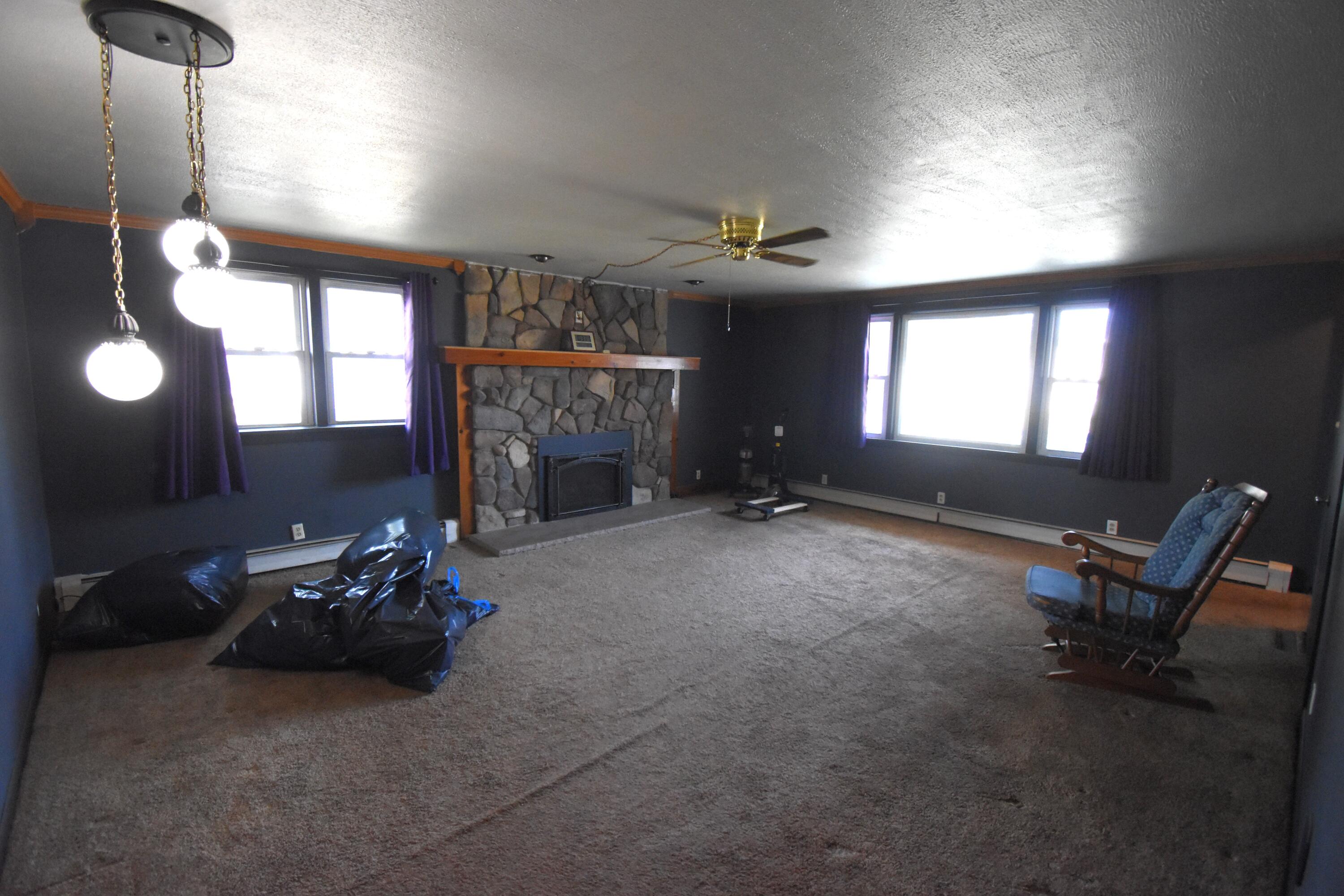 719 North Monroe Street Rensselaer, IN 47978 - Photo 11 of 41 a living room with furniture a window and a fireplace
