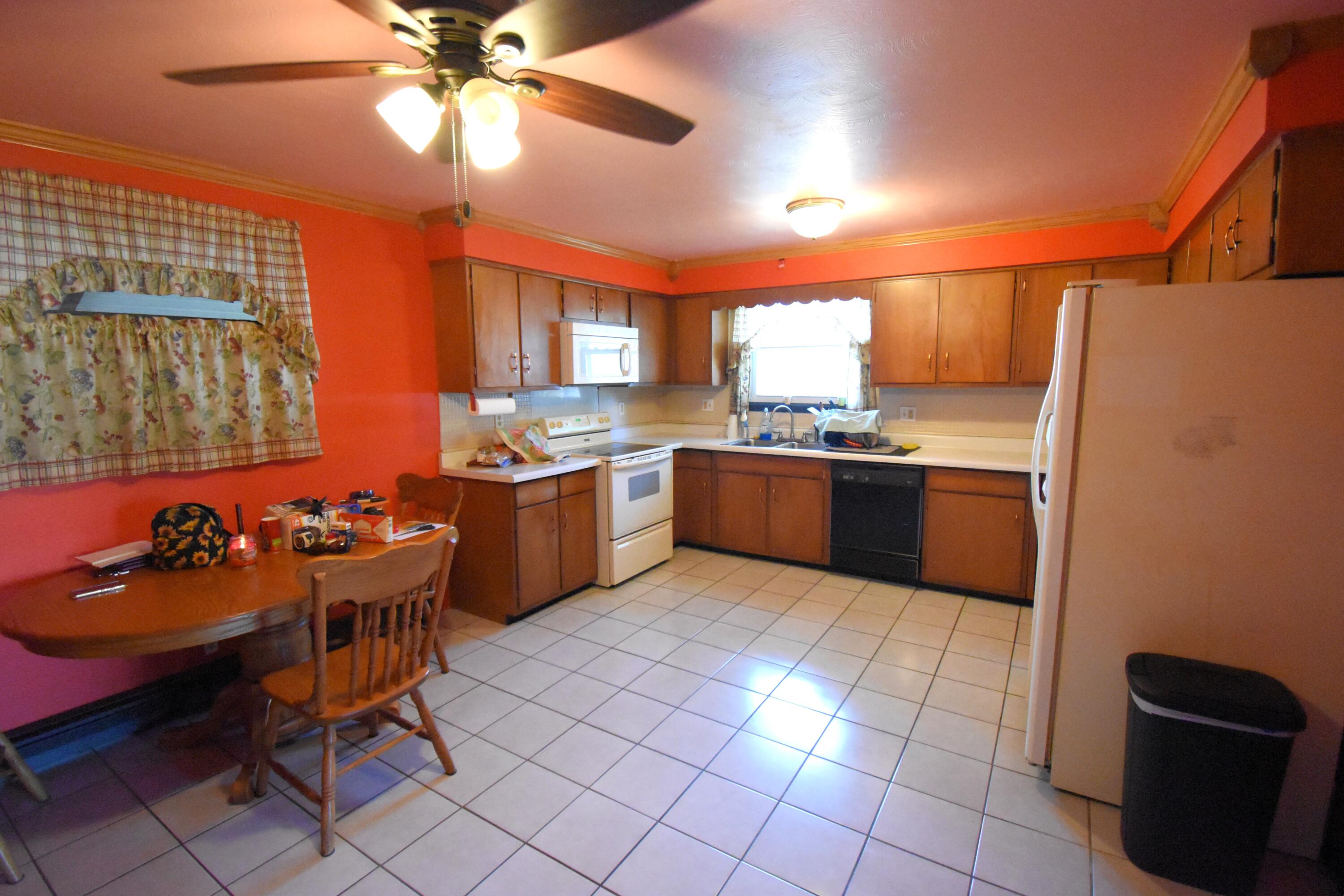 719 North Monroe Street Rensselaer, IN 47978 - Photo 13 of 41 a kitchen with stainless steel appliances a sink a counter top space cabinets and a window