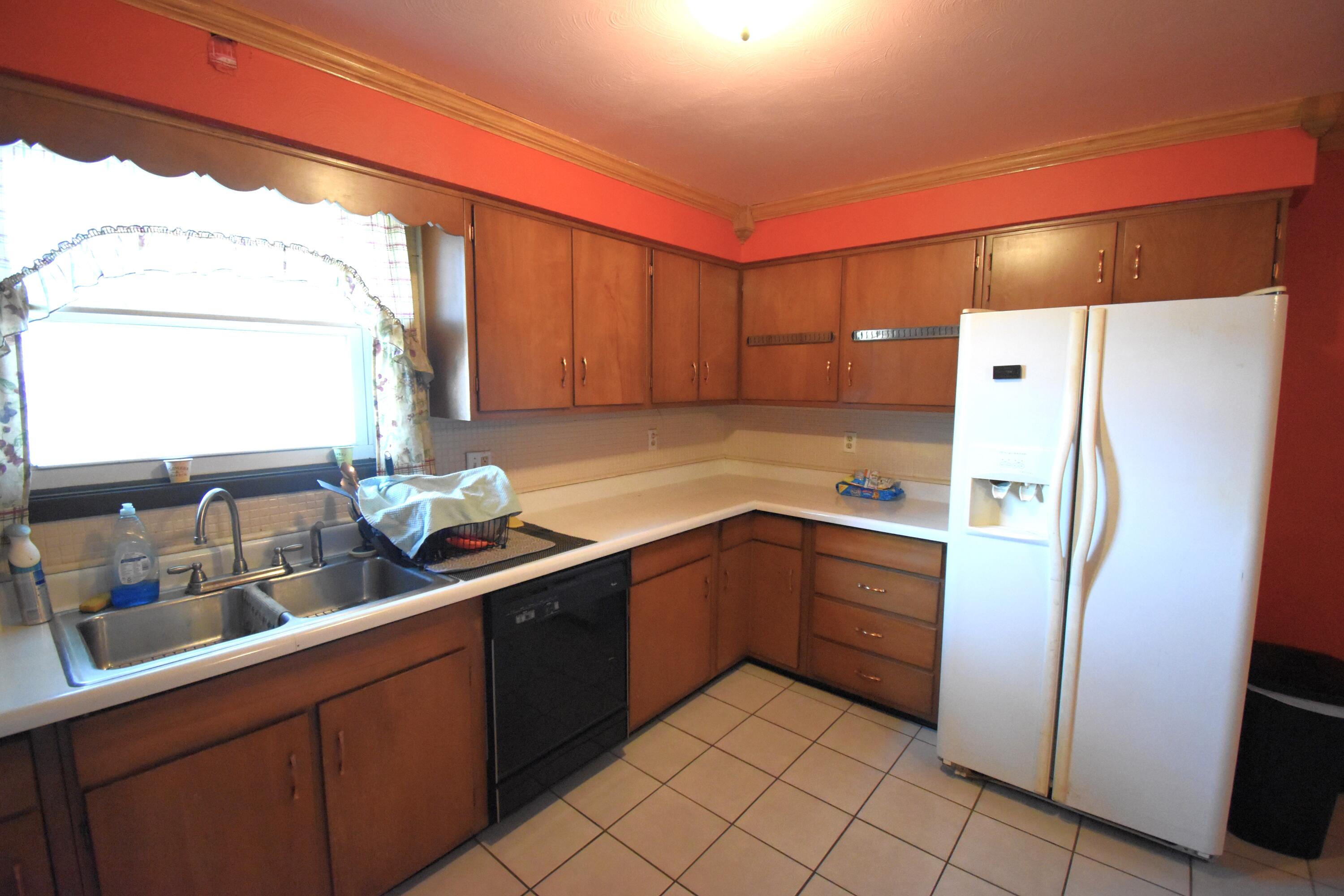 719 North Monroe Street Rensselaer, IN 47978 - Photo 15 of 41 a kitchen with stainless steel appliances granite countertop a refrigerator and a sink