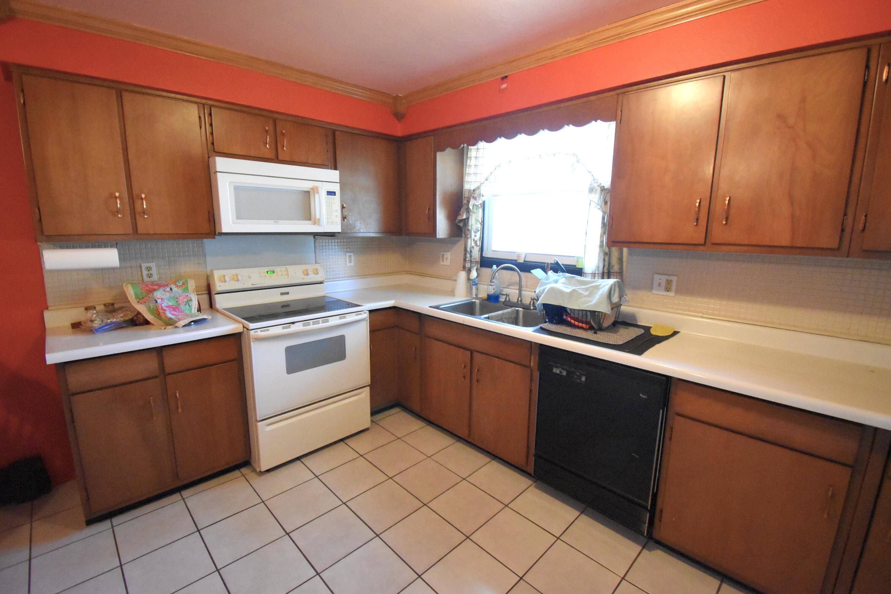 719 North Monroe Street Rensselaer, IN 47978 - Photo 16 of 41 a kitchen with a sink cabinets and window