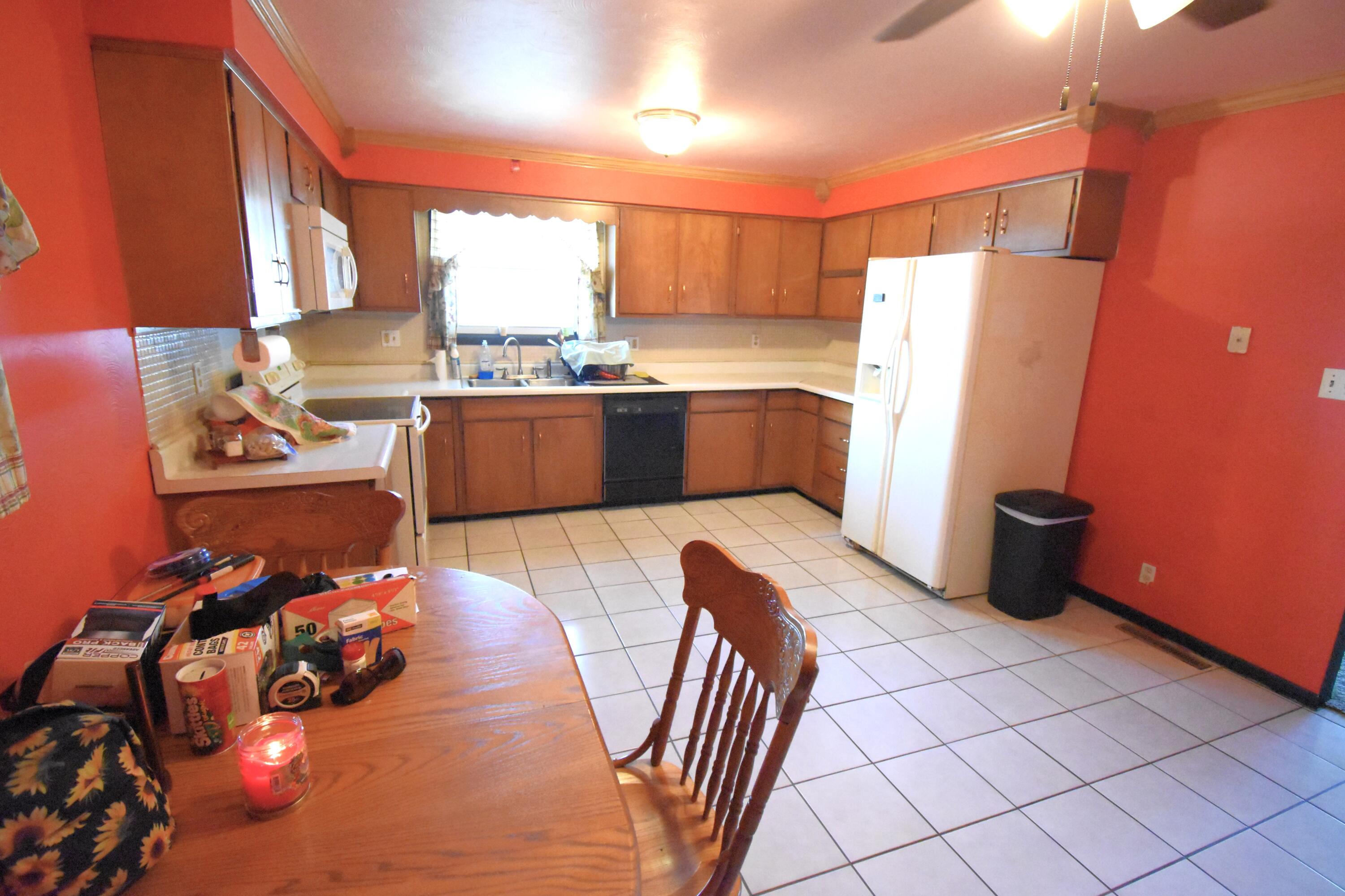 719 North Monroe Street Rensselaer, IN 47978 - Photo 17 of 41 a kitchen with stainless steel appliances a refrigerator and a stove
