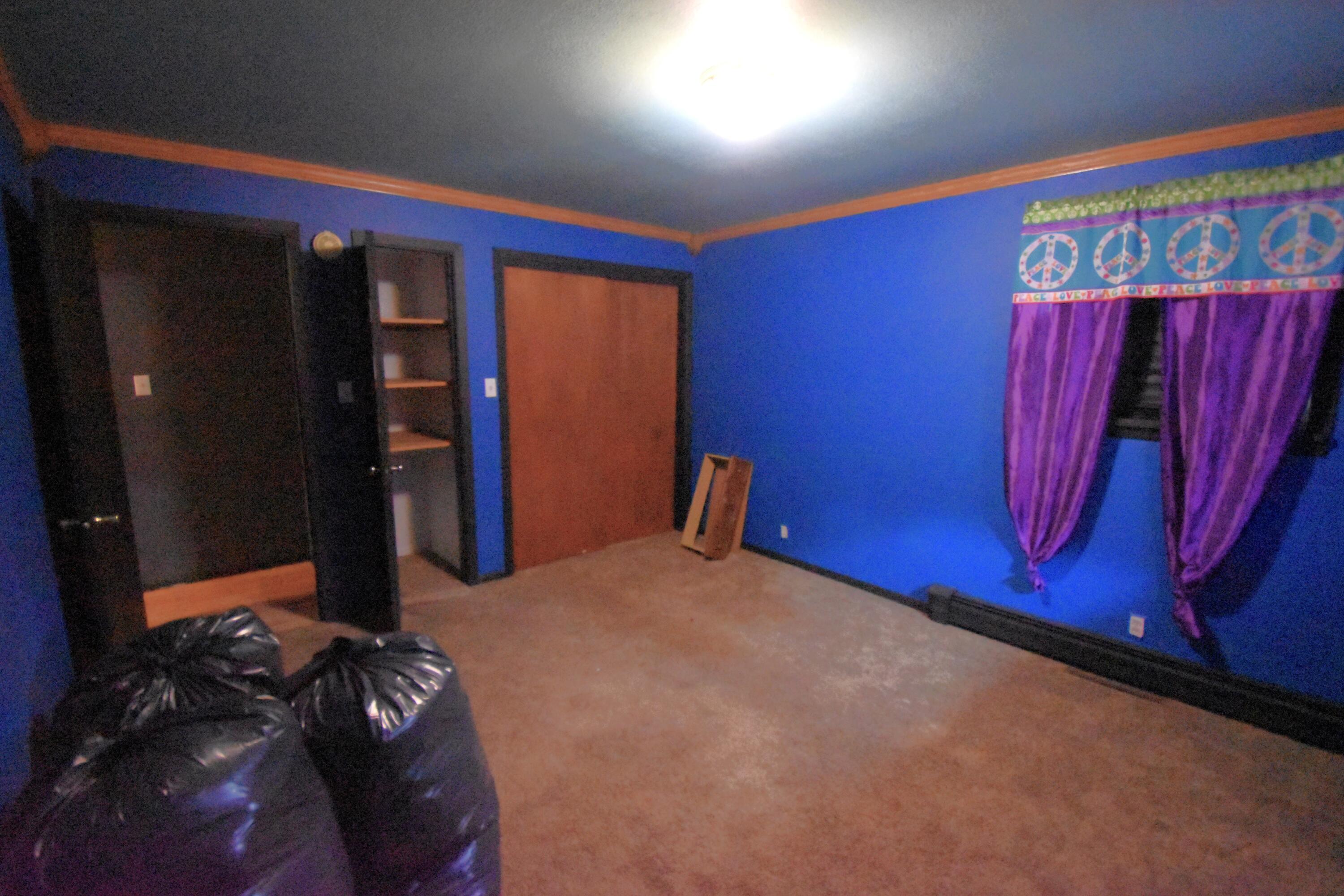 719 North Monroe Street Rensselaer, IN 47978 - Photo 33 of 41 a bedroom with a bed and a mirror