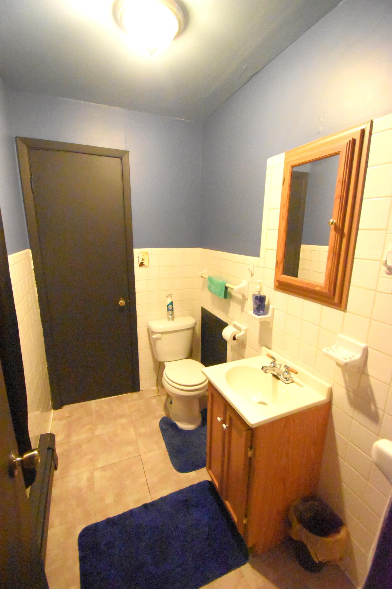 719 North Monroe Street Rensselaer, IN 47978 - Photo 35 of 41 a bathroom with a sink a toilet and mirror