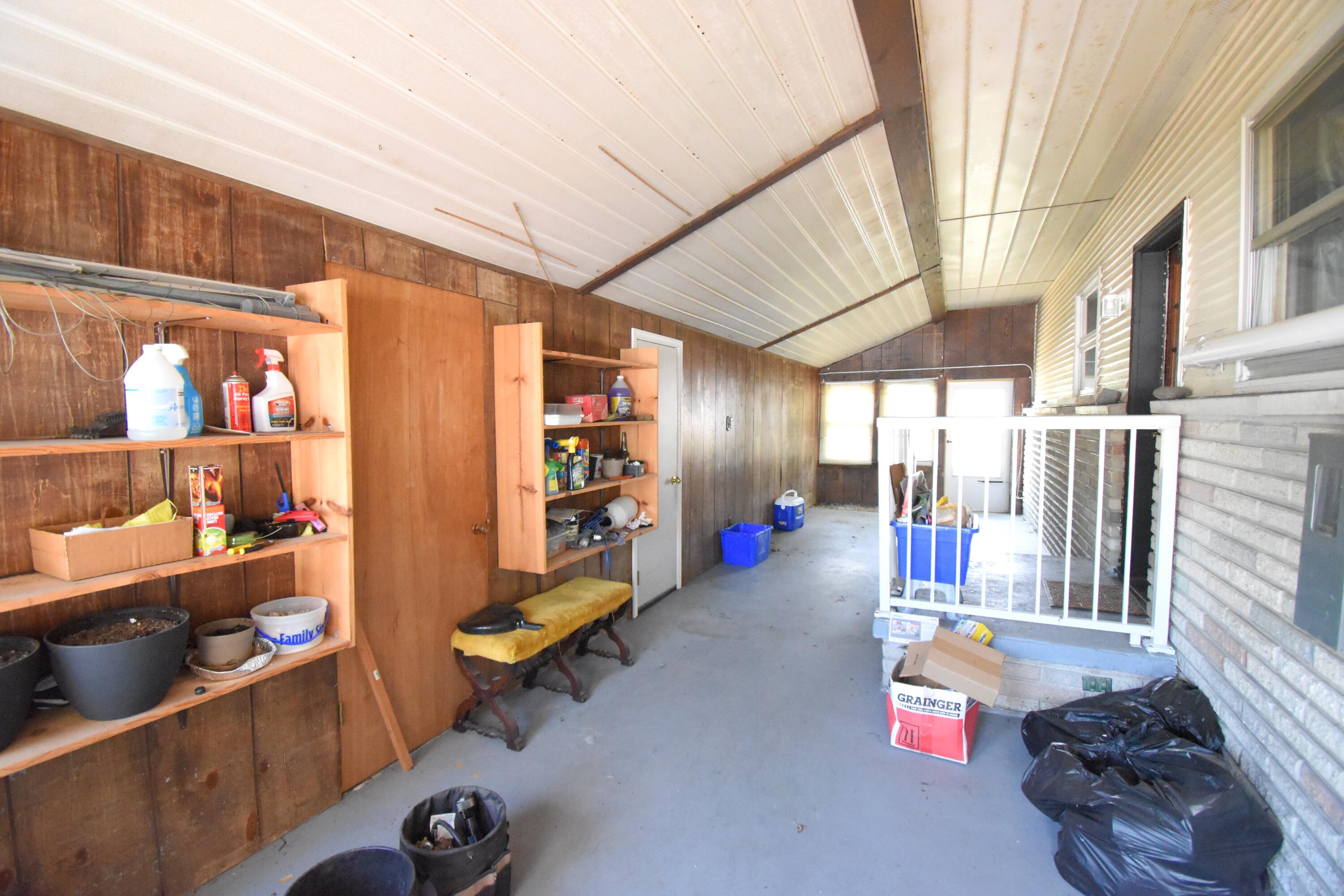719 North Monroe Street Rensselaer, IN 47978 - Photo 39 of 41 a room with lots of wooden furniture and a rug