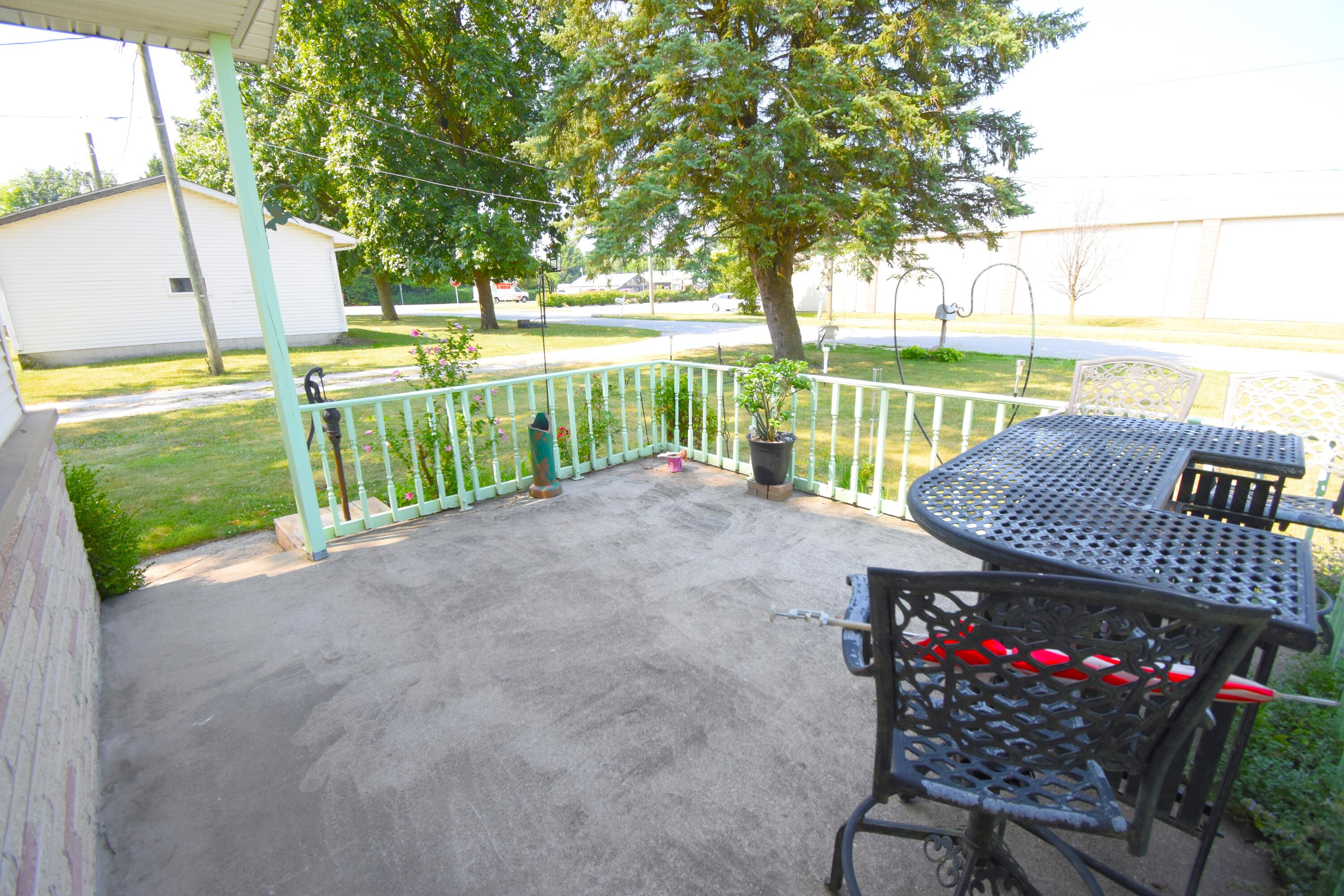 719 North Monroe Street Rensselaer, IN 47978 - Photo 5 of 41 a view of a backyard with a deck and a garden