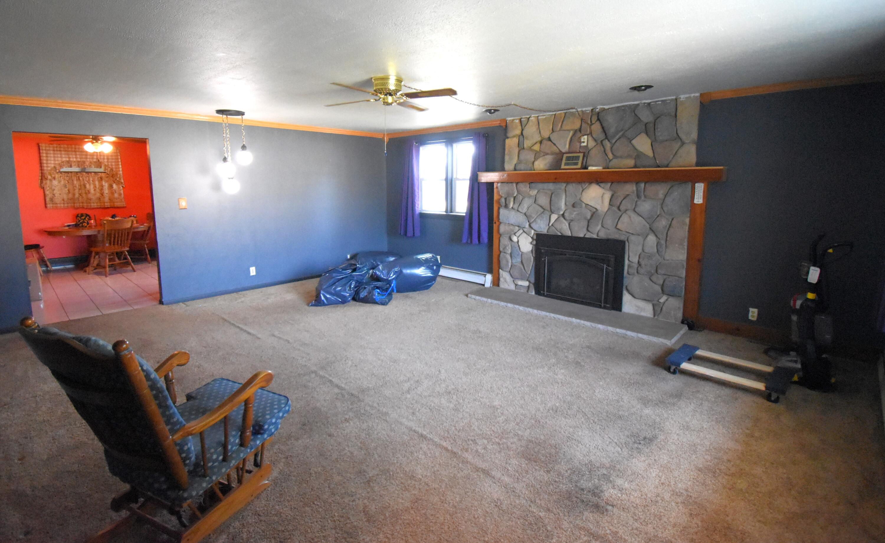 719 North Monroe Street Rensselaer, IN 47978 - Photo 10 of 41 a bed room with a bed and a fireplace