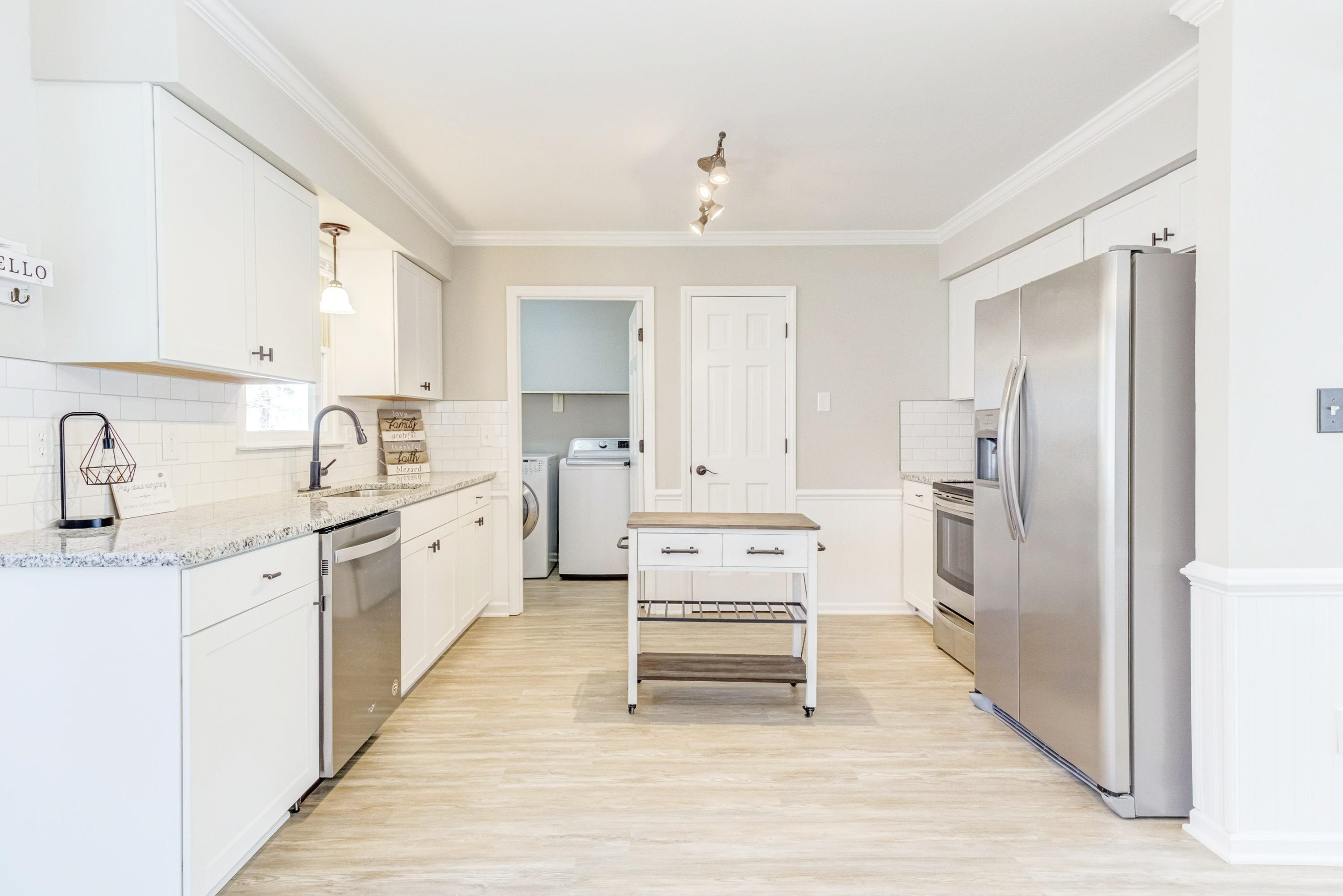 9305 Tallgrass Road Raleigh, NC 27603 - Photo 8 of 49 Stainless appliances incl new dishwasher, side by side fridge, smooth top range and built in microwave! Kitchen