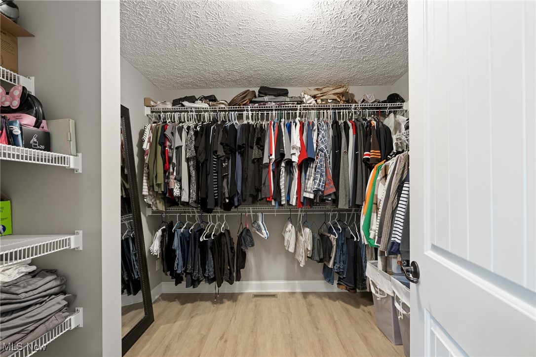 3124 Huntcliffe Road Northeast Canton, OH 44721 - Photo 24 of 35 Spacious closet with hardwood / wood-style flooring