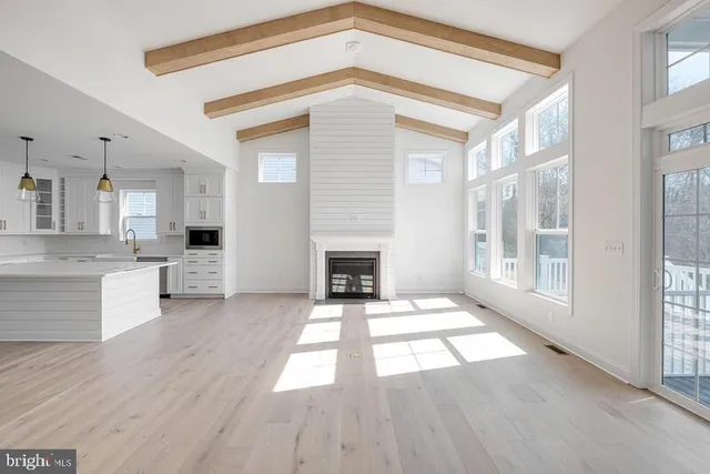 a view of open kitchen with granite countertop a fireplace