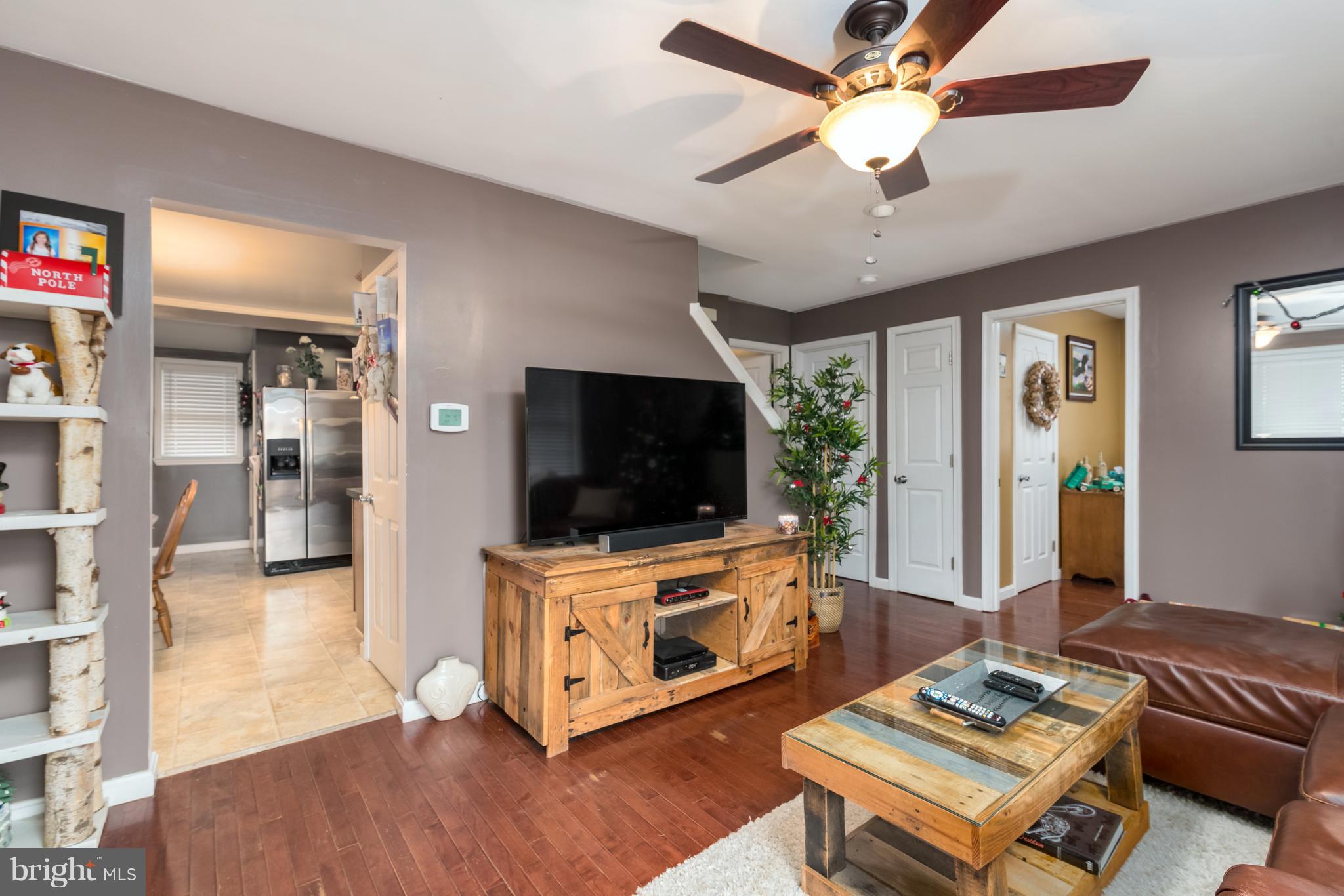 8217 Northview Road Baltimore, MD 21222 - Photo 5 of 21 a living room with furniture and a flat screen tv