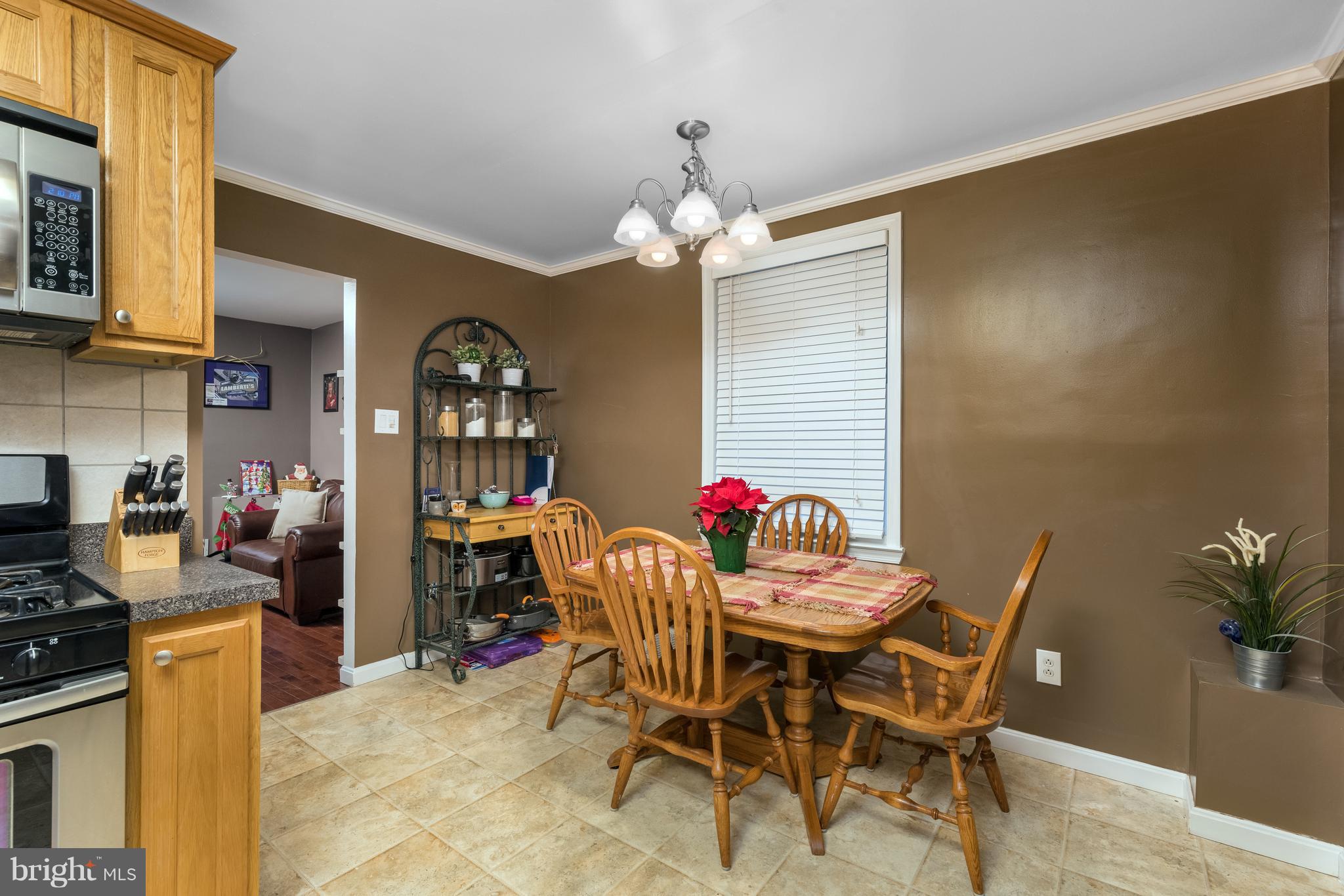 8217 Northview Road Baltimore, MD 21222 - Photo 9 of 21 a dining room with furniture and chandelier