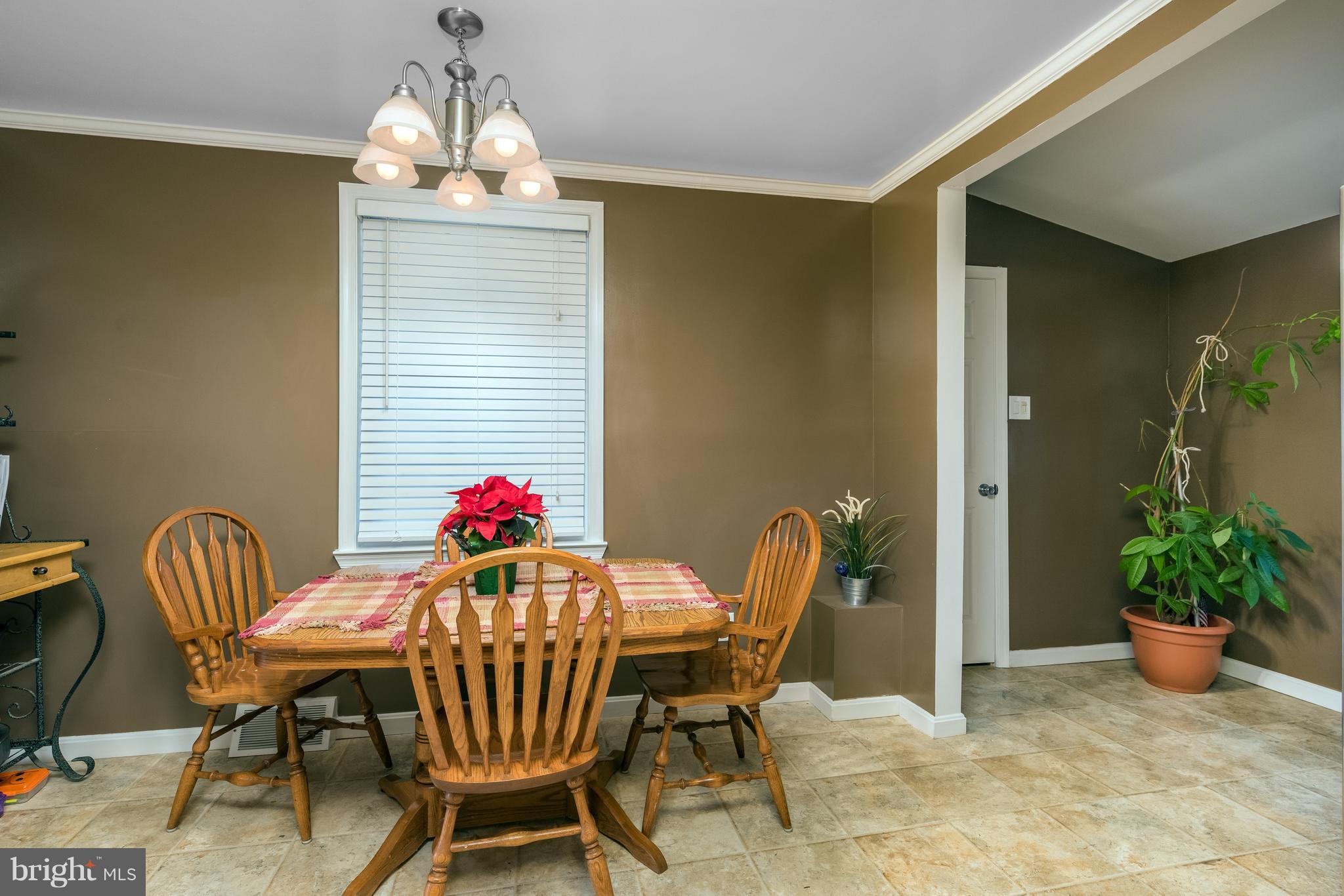 8217 Northview Road Baltimore, MD 21222 - Photo 10 of 21 a view of a dining room with furniture and chandelier