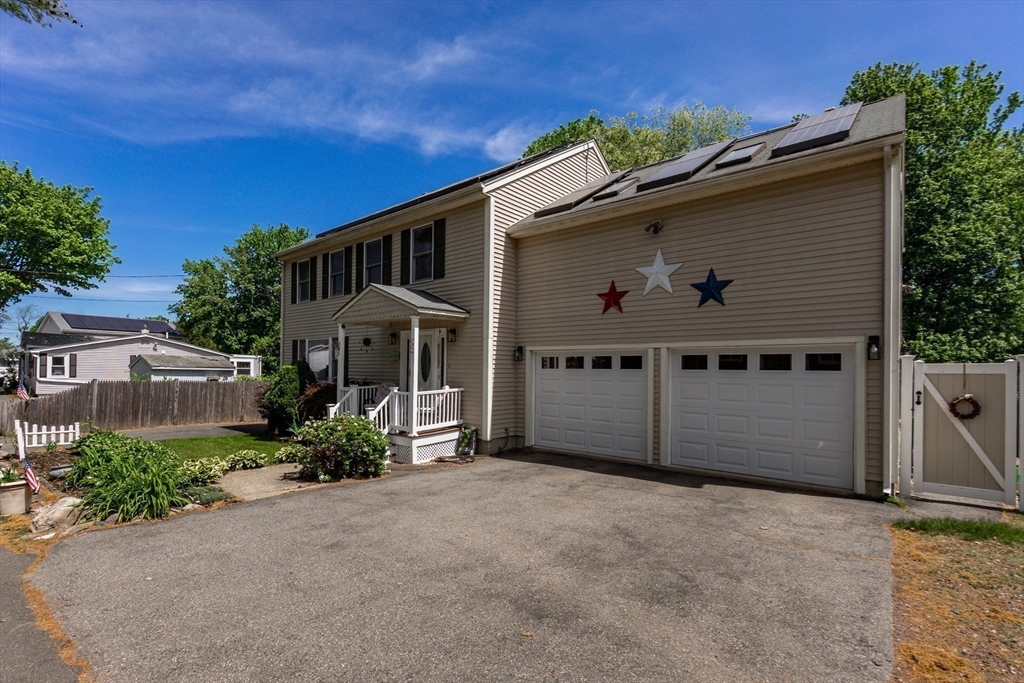 63 Bow Street Saugus, MA 01906 - Photo 41 of 42 a front view of a house with a yard