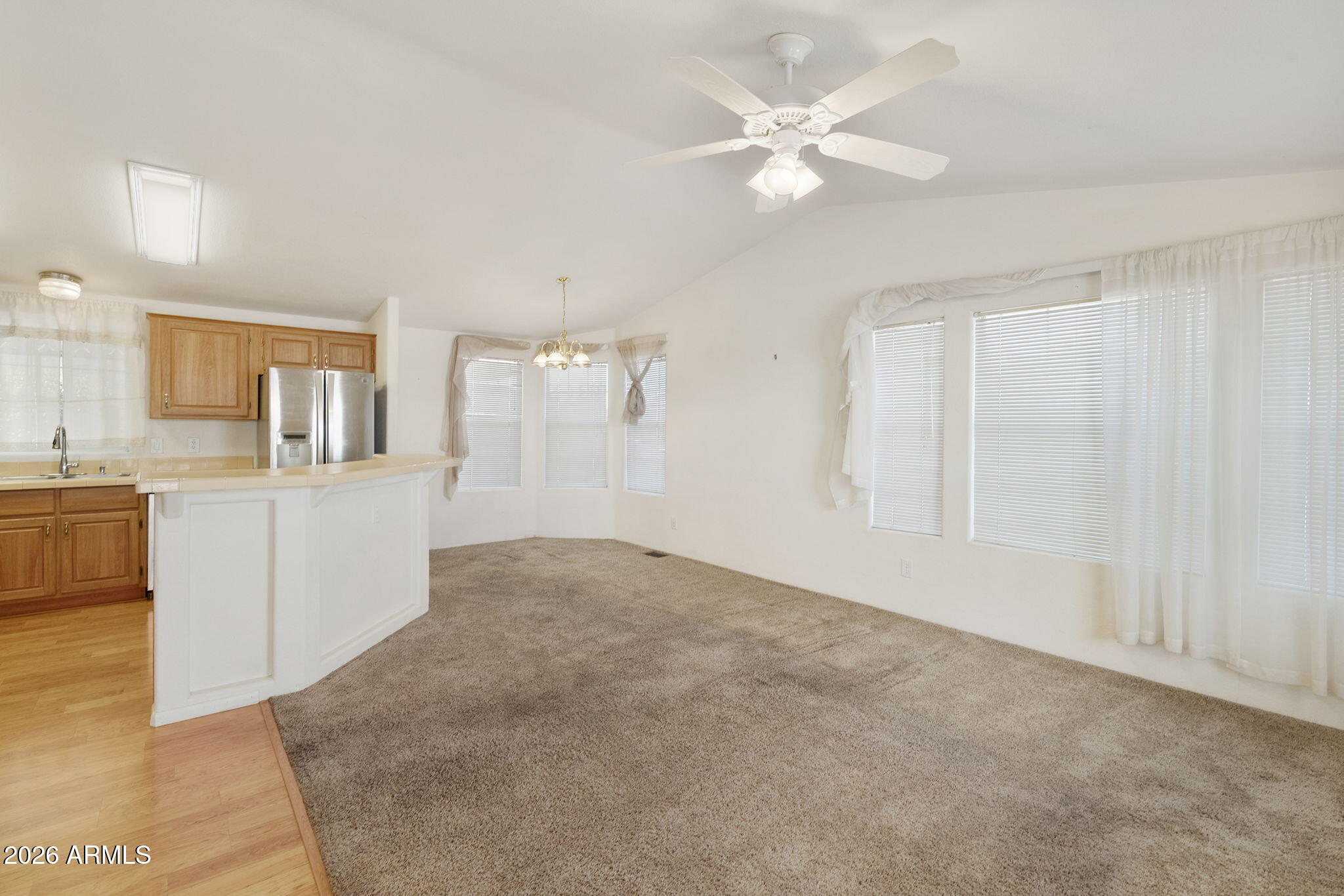 3700 South Tomahawk Road, Unit 73 Apache Junction, AZ 85119 - Photo 26 of 49 a view of a kitchen with marble kitchen and kitchen island