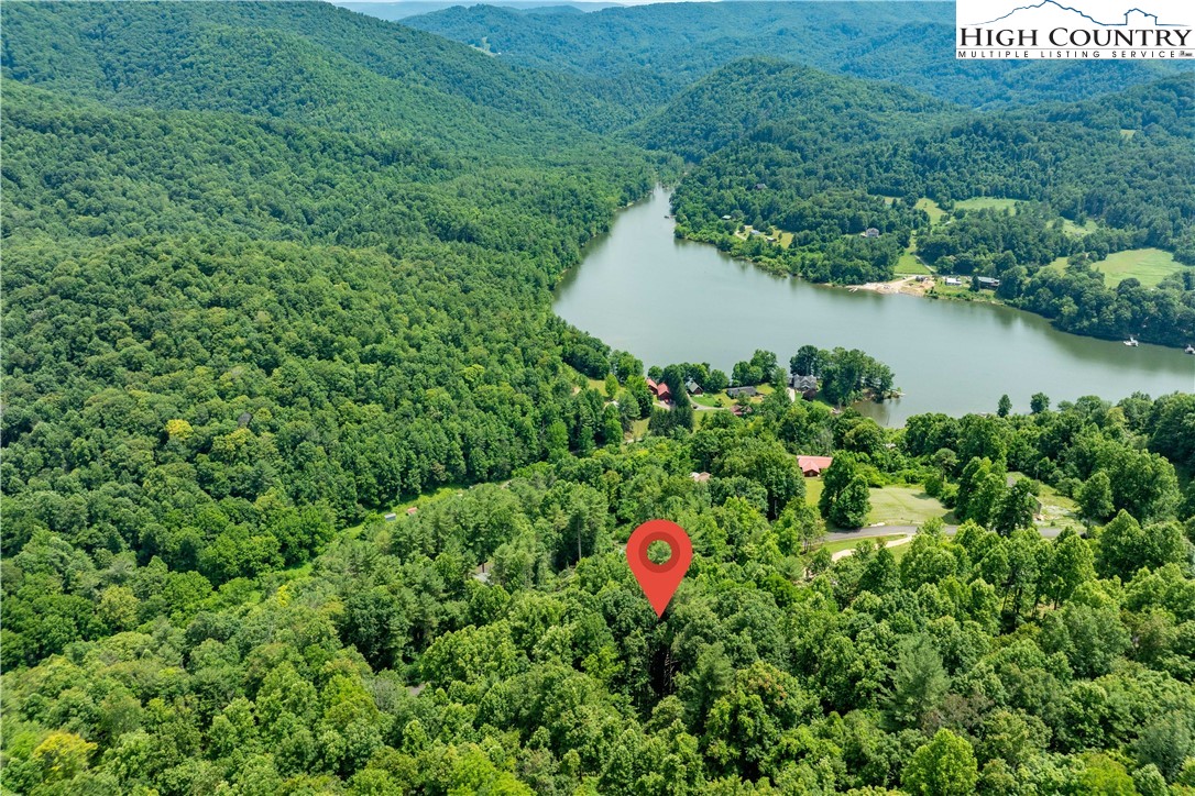 Lot 13 Lake Ridge Butler, TN 37640 - Photo 13 of 25 a view of a house with a yard and lake view
